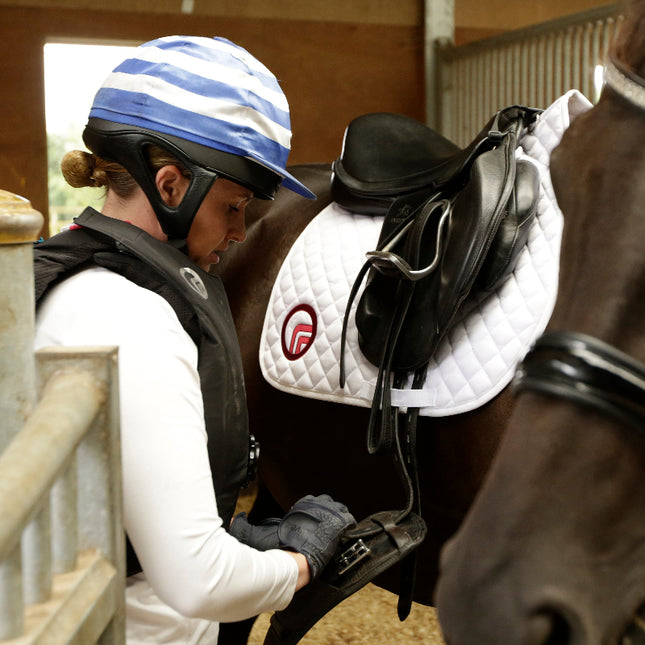 horse saddle cloth and rider