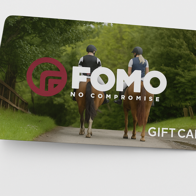 FOMO gift card with two people riding horses on a path in a forest.