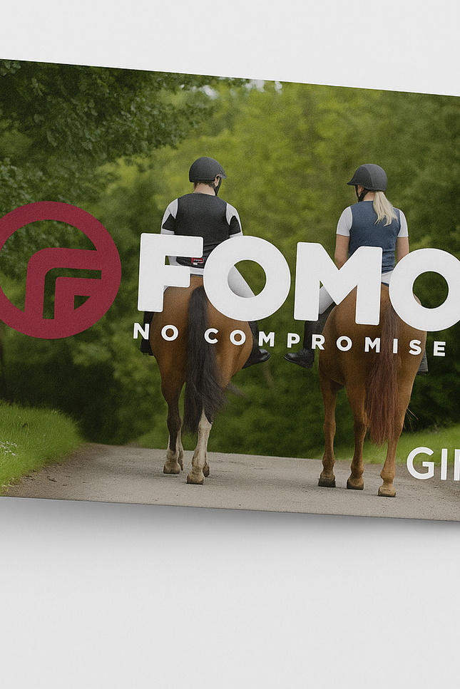 FOMO gift card with two people riding horses on a path in a forest.