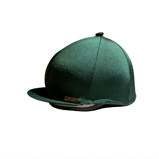 Green riding helmet on a white background