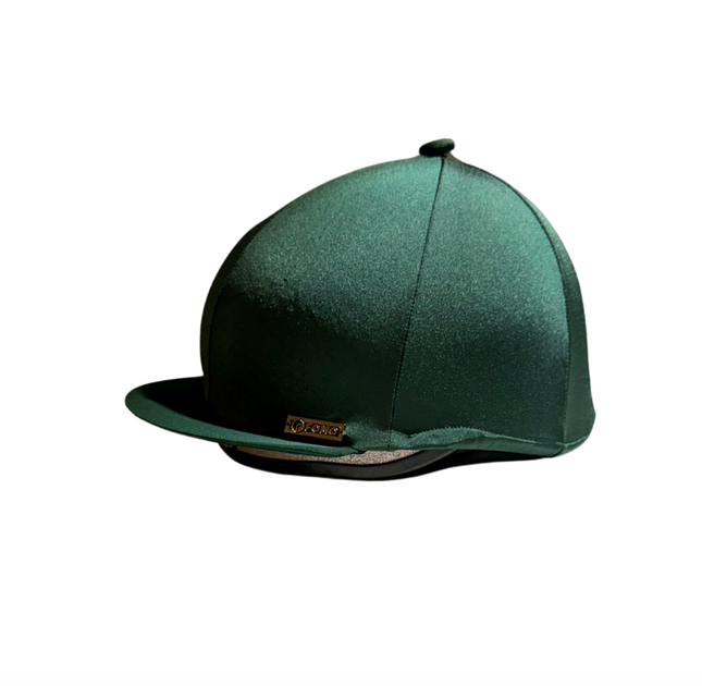 Green riding helmet on a white background